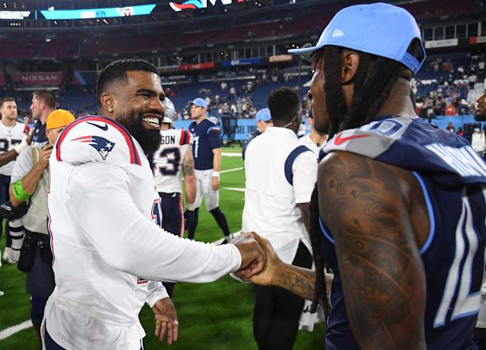 New England Patriots running back Ezekiel Elliott (15) talks with Tennessee Titans wide receiver DeAndre Hopkins (10) after a Titans win at Nissan Stadium.